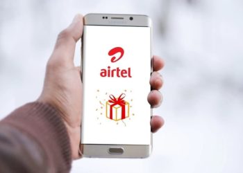 Man Holding phone with airtel